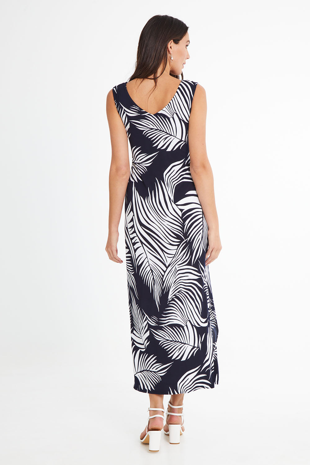 Model Madeline wearing size 10 of the Moonshadow Palm Maxi Dress in colour Navy (Blue), from the back