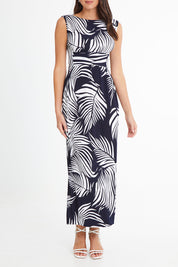 Model Madeline wearing size 10 of the Moonshadow Palm Maxi Dress in colour Navy (Blue), from the front, cropped image