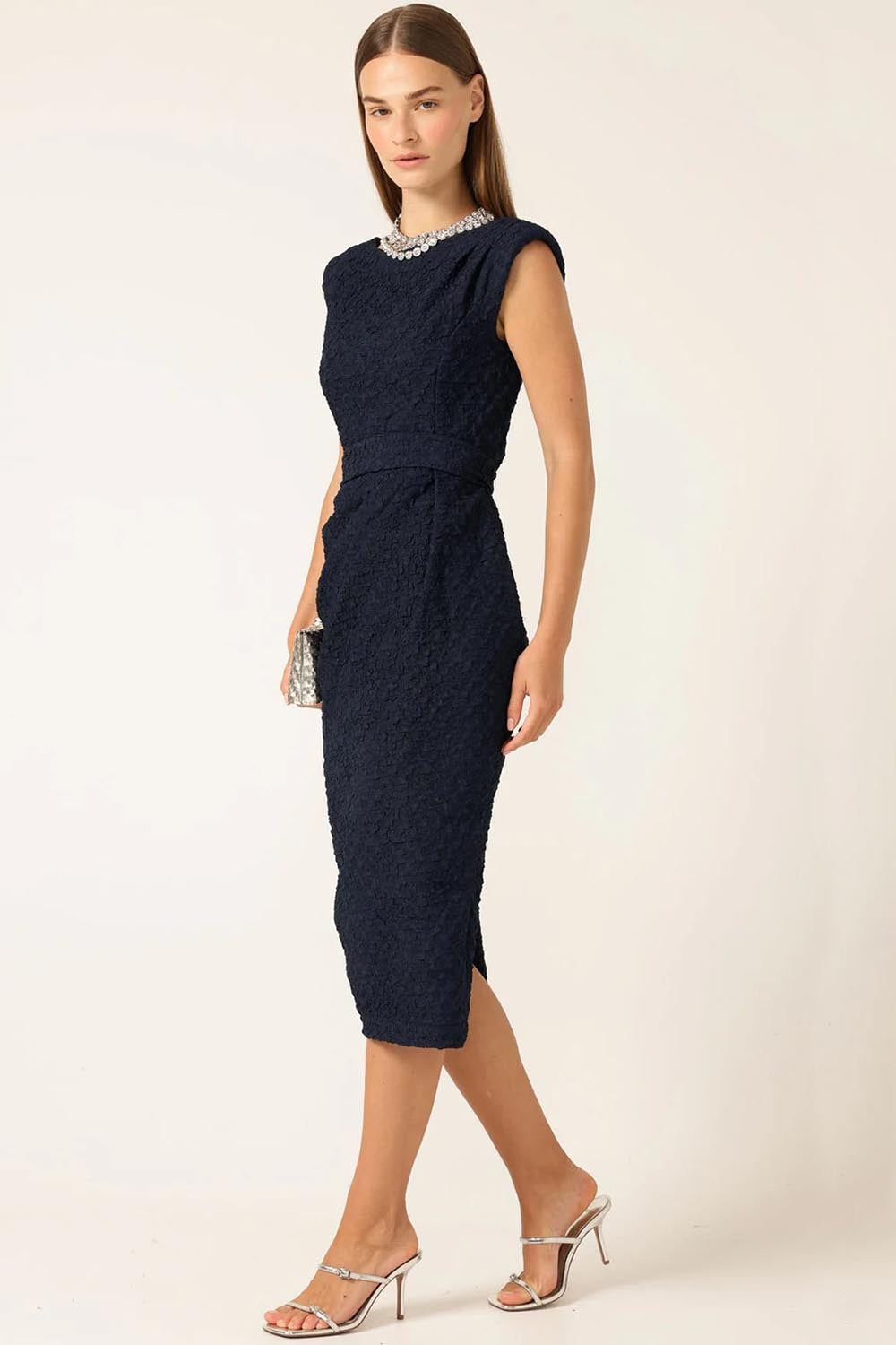A model wearing the Celestial Dress in colour Navy (Blue), from the front, showing the whole outfit