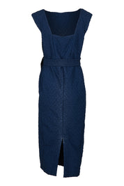 Product shot of the Celestial Dress in colour Navy (Blue), from the back