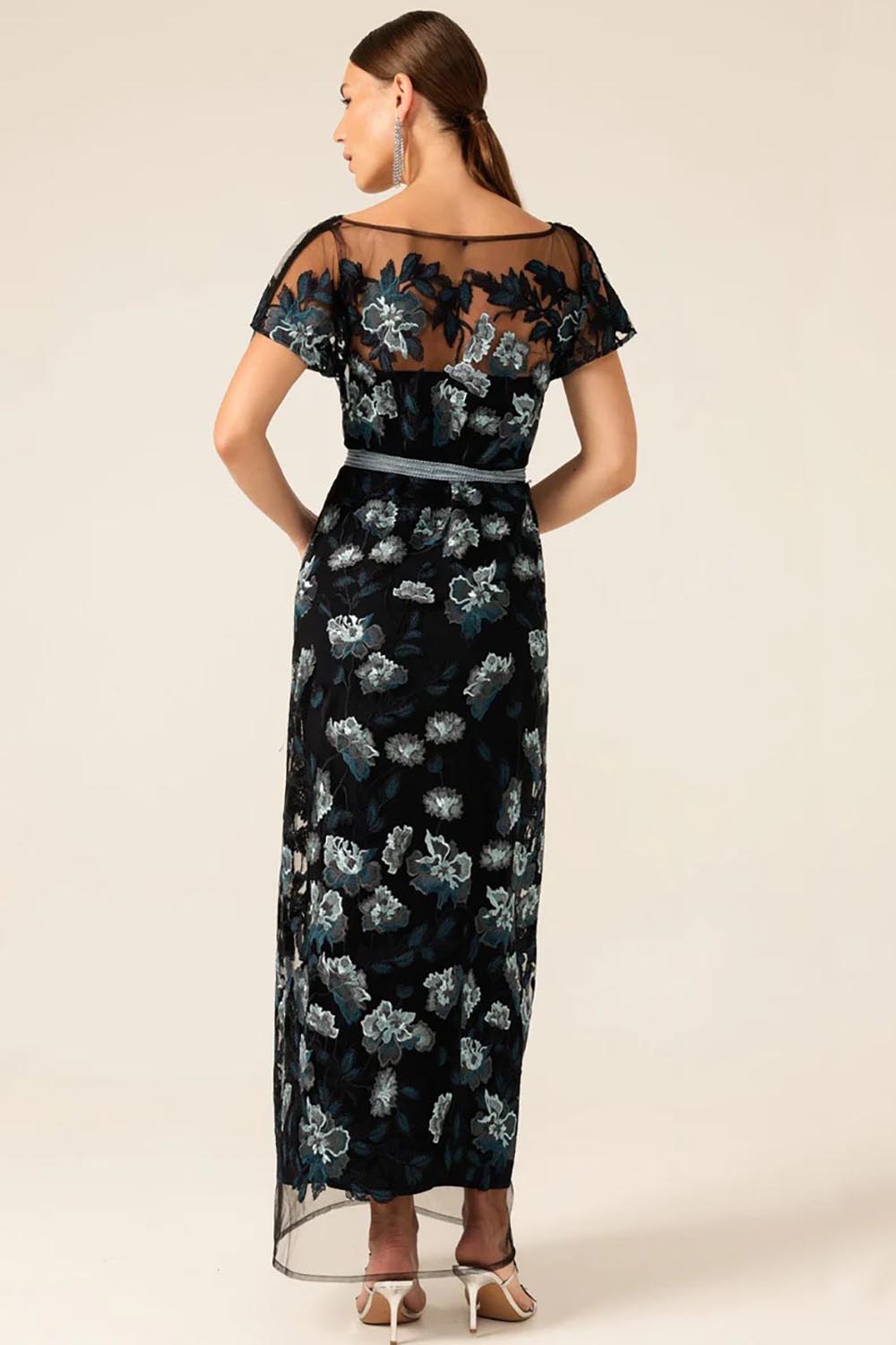 A model wearing the Love Potion Maxi Dress in colour Midnight (Blue), from the back