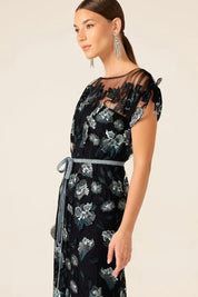 A model wearing the Love Potion Maxi Dress in colour Midnight (Blue), from the front, cropped image
