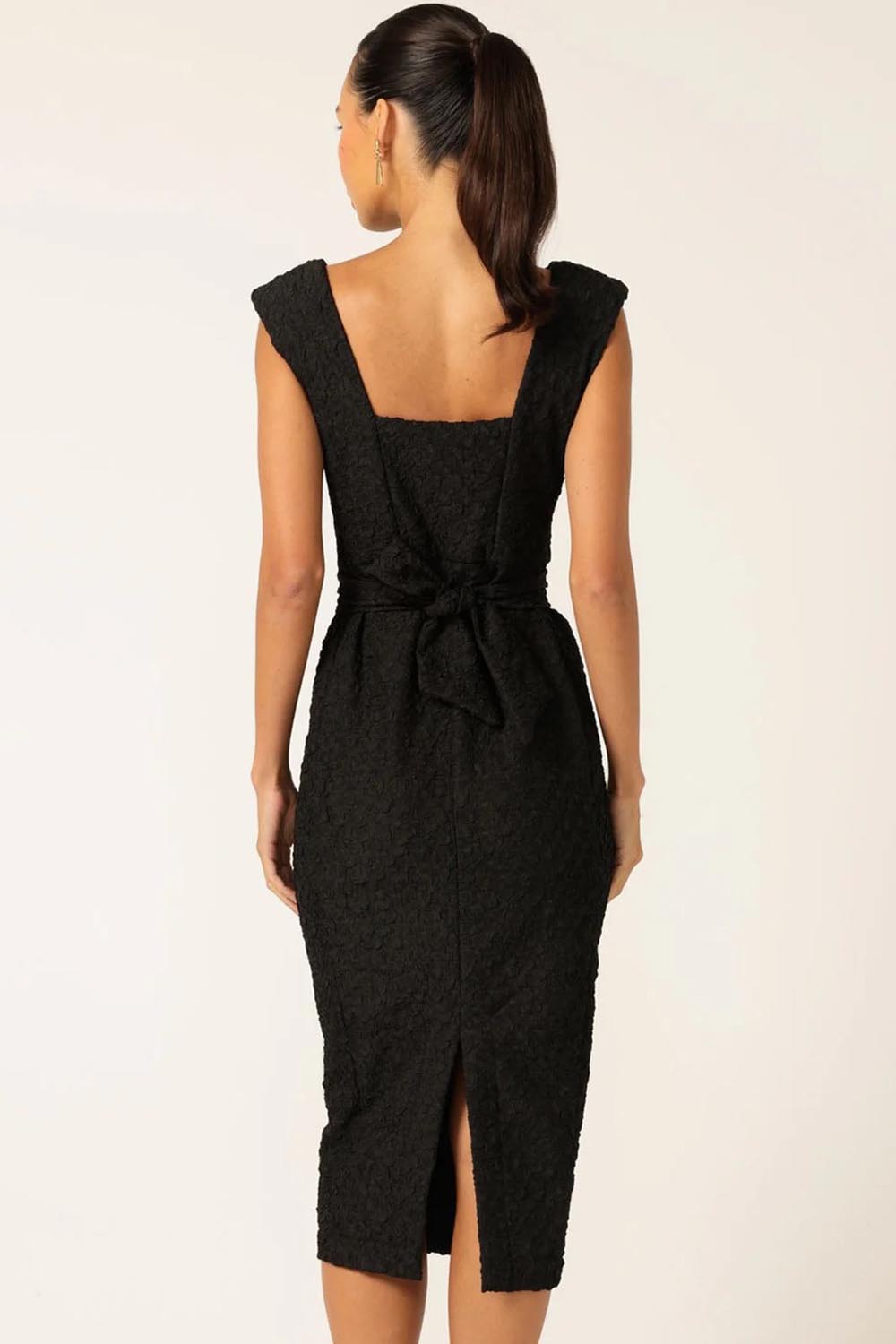 A model wearing the Celestial Dress in colour Black (Black), from the back
