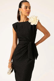 A model wearing the Celestial Dress in colour Black (Black), from the front, cropped image