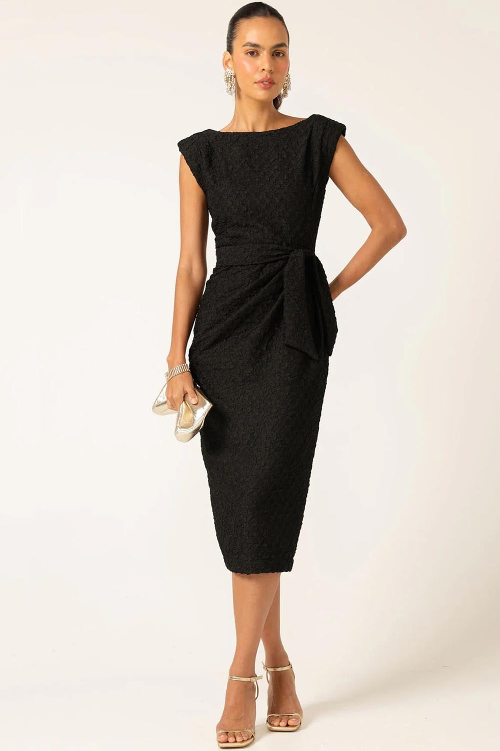 A model wearing the Celestial Dress in colour Black (Black), from the front, showing the whole outfit