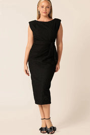 A model wearing the Celestial Dress in colour Black (Black), from the front, showing the whole outfit