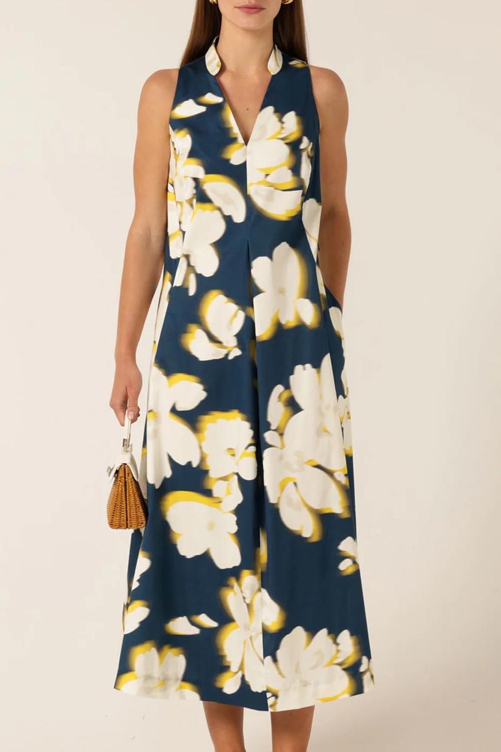 A model wearing the Simone Cotton Dress in colour Navy (Blue), from the front, cropped image