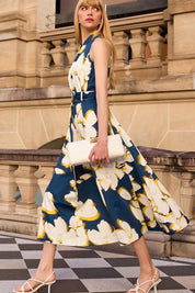 A model wearing the Simone Cotton Dress in colour Navy (Blue), from the front, showing the whole outfit