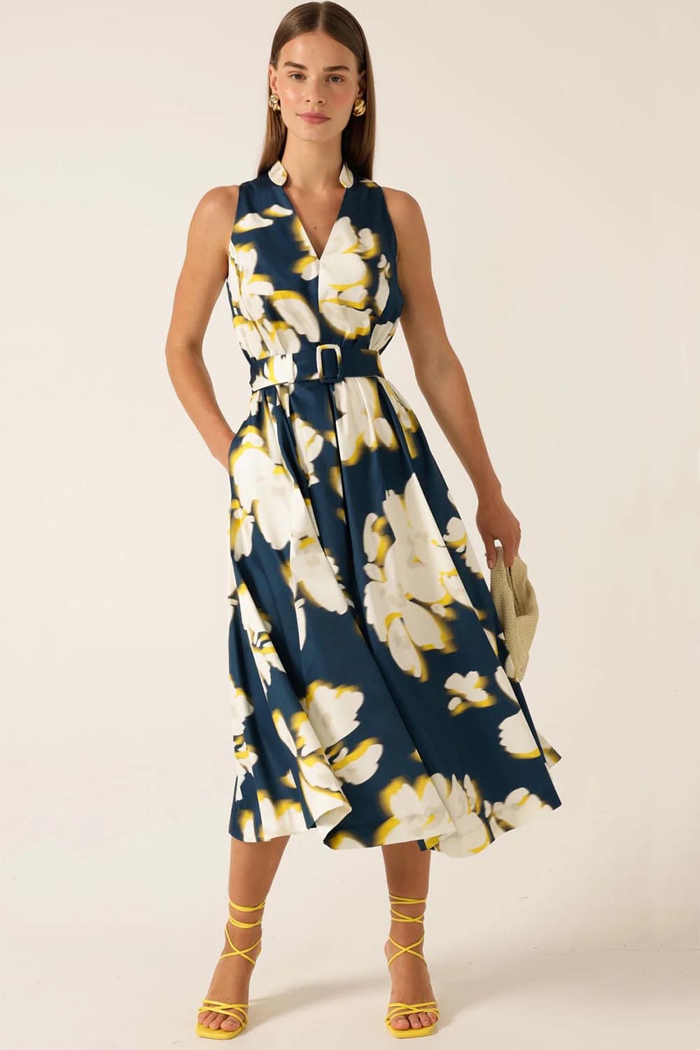 A model wearing the Simone Cotton Dress in colour Navy (Blue), from the front, showing the whole outfit