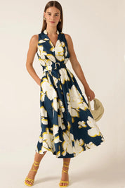 A model wearing the Simone Cotton Dress in colour Navy (Blue), from the front, showing the whole outfit