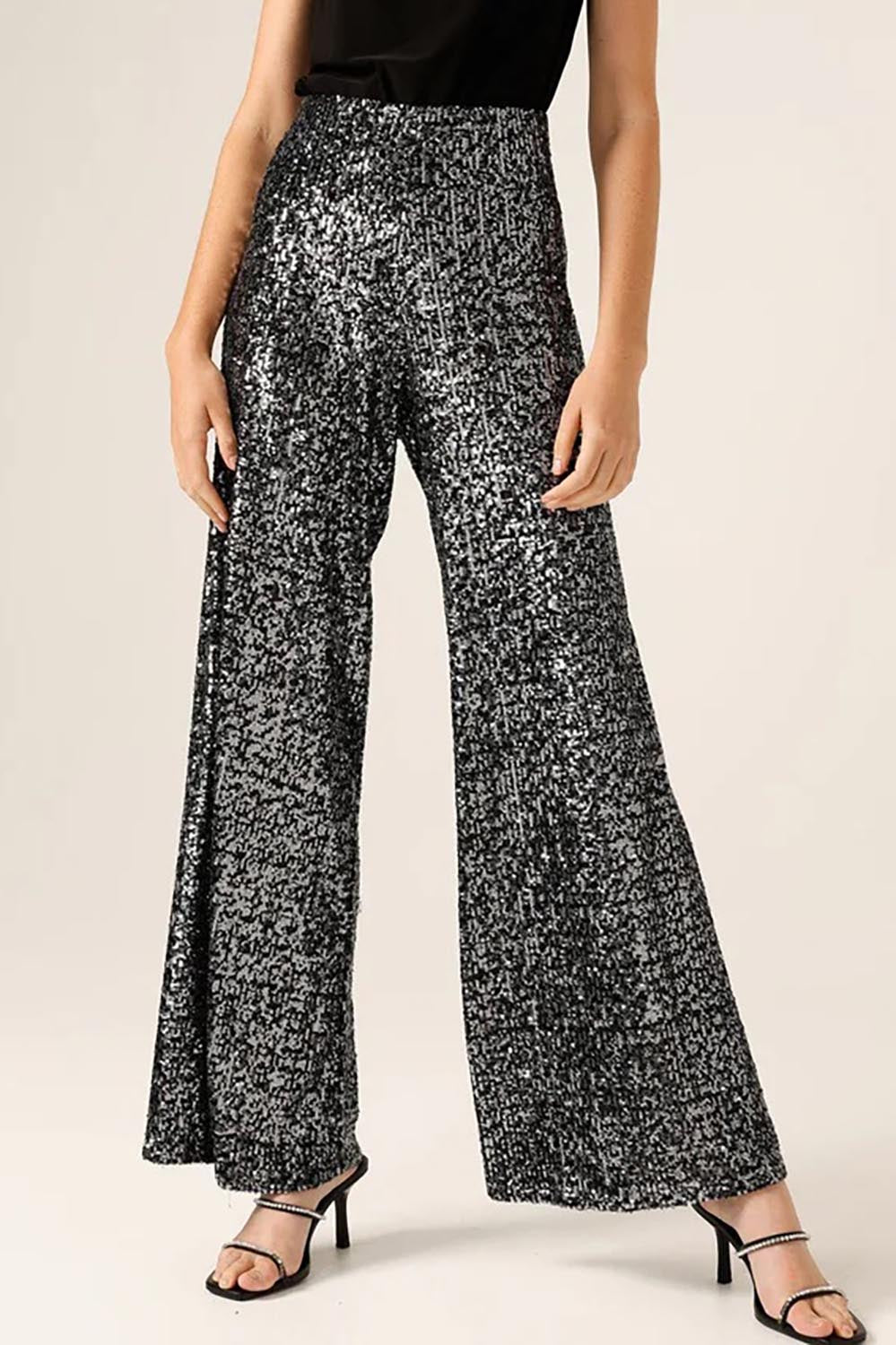 A model wearing the Sequin Palazzo Pants in colour Blksilver (Black), from the front, cropped image