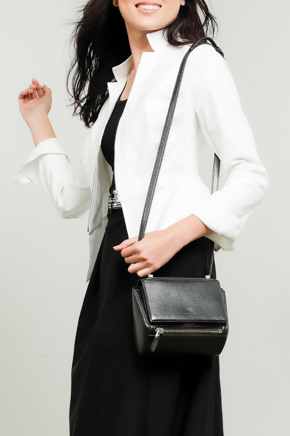A model wearing the Front Zip Peplum Jacket in colour White (White), from the front, cropped image