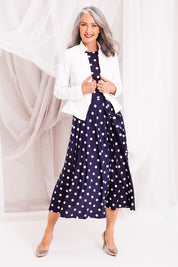 Model Luisa wearing size 10 of the Front Zip Peplum Jacket in colour White (White), from the front, showing the whole outfit