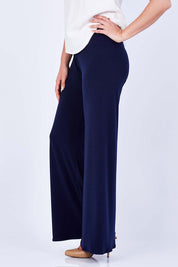 Model Phoebe wearing size 10 of the Seamless Pant in colour Navy (Blue), from the front, cropped image
