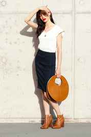 A model wearing the Analia Top in colour White (White), from the front, showing the whole outfit