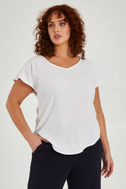 Model Maddy wearing size 16 of the Analia Top in colour White (White), from the front, cropped image