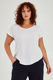 Model Maddy wearing size 16 of the Analia Top in colour White (White), from the front, cropped image