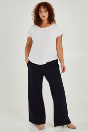 Model Maddy wearing size 16 of the Analia Top in colour White (White), from the front, showing the whole outfit