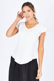 Model Madeline wearing size 10 of the Analia Top in colour White (White), from the front, cropped image