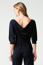 A model wearing the Cowl Tie Top in colour Navy (Blue), from the front, cropped image