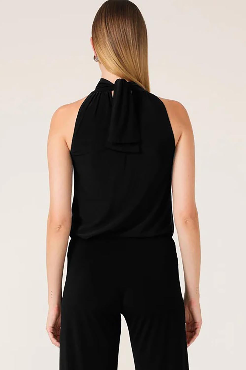 A model wearing the High Neck Tie Top in colour Black (Black), from the back