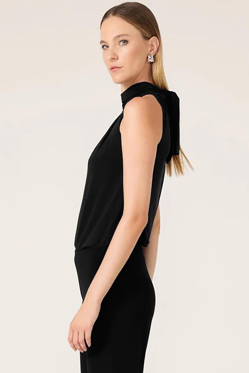 A model wearing the High Neck Tie Top in colour Black (Black), from the front, cropped image