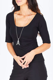 Model Gemma wearing size 10 of the 3/4 Sleeve Top in colour Black (Black), from the front, cropped image