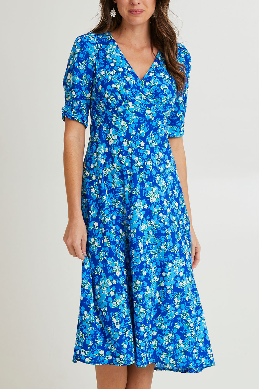 Model Madeline wearing size 10 of the Sweet Pea Midi Dress in colour Blue (Blue), from the front, cropped image