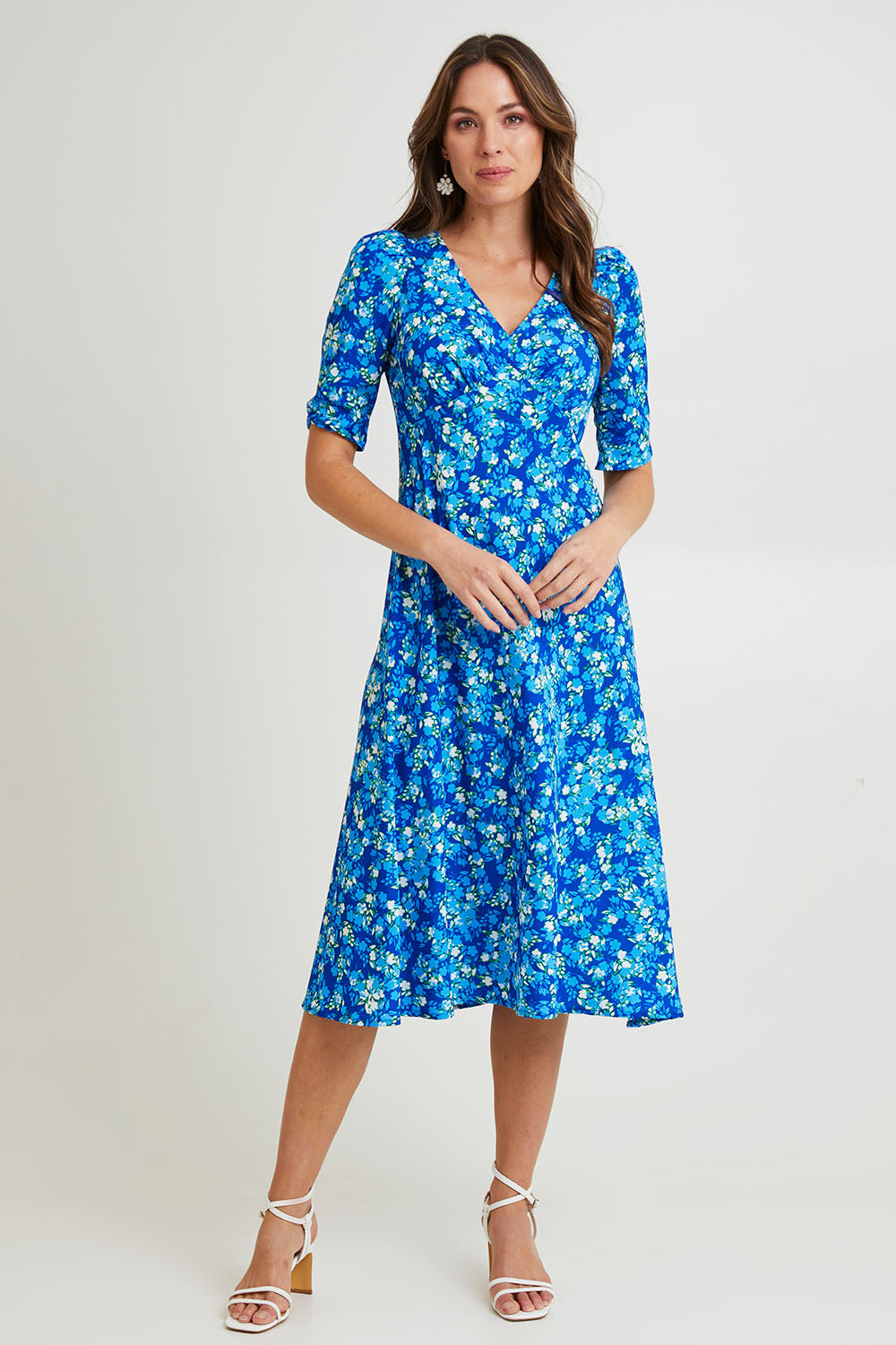 Model Madeline wearing size 10 of the Sweet Pea Midi Dress in colour Blue (Blue), from the front, showing the whole outfit