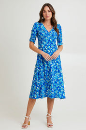 Model Madeline wearing size 10 of the Sweet Pea Midi Dress in colour Blue (Blue), from the front, showing the whole outfit