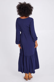 Model Olivia wearing size 10 of the Brigitte Balloon Sleeve Maxi Dress in colour Navy (Blue), from the back