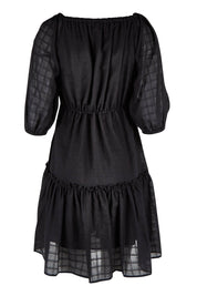 Product shot of the Ruby Tiered Midi Dress in colour Black (Black), from the back