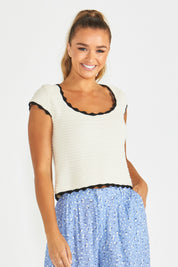 A model wearing the Coco Crochet Cotton Knit Top in colour Cream, from the front, cropped image