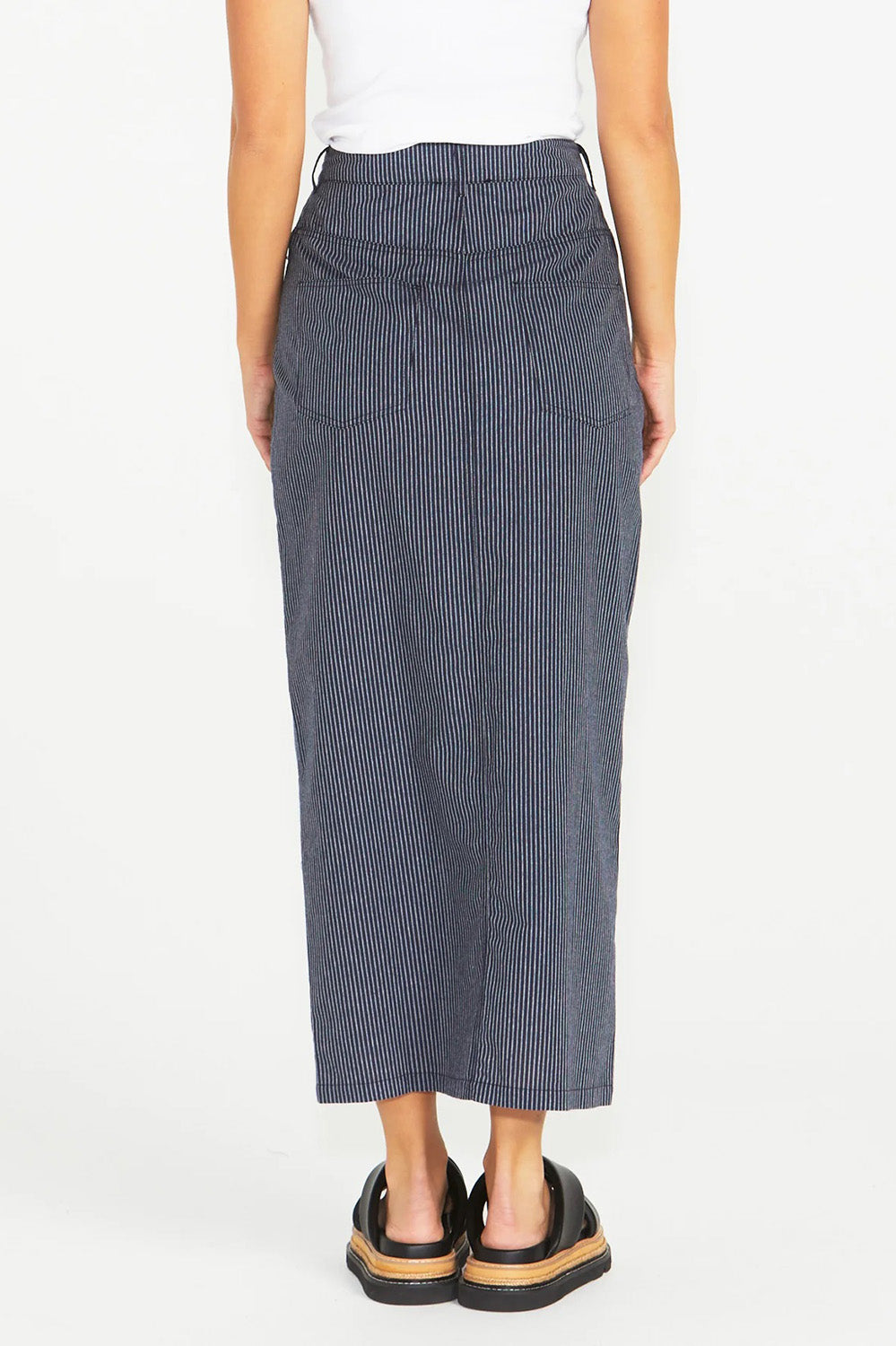 A model wearing the Liberty Cotton Maxi Skirt in colour Navy (Blue), from the back