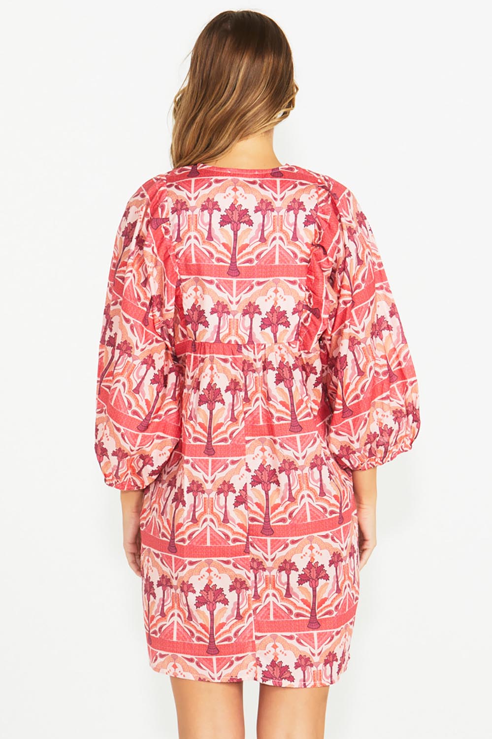 A model wearing the Zayda Cotton Dress in colour Arabian (Pink), from the back