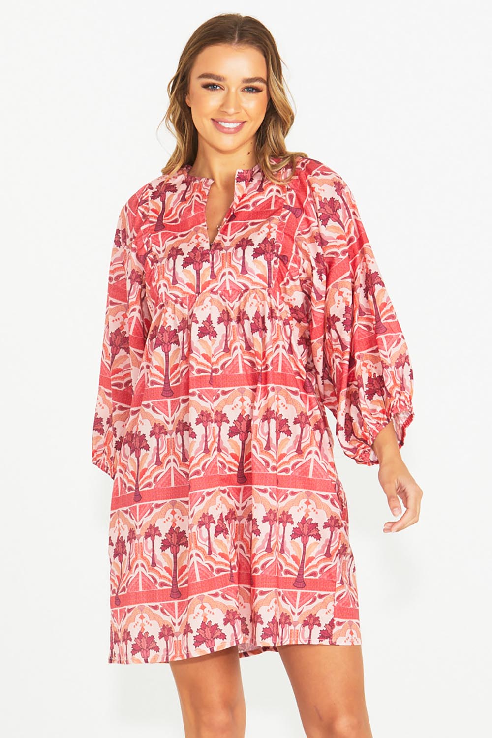 A model wearing the Zayda Cotton Dress in colour Arabian (Pink), from the front, cropped image