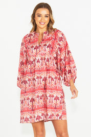 A model wearing the Zayda Cotton Dress in colour Arabian (Pink), from the front, cropped image