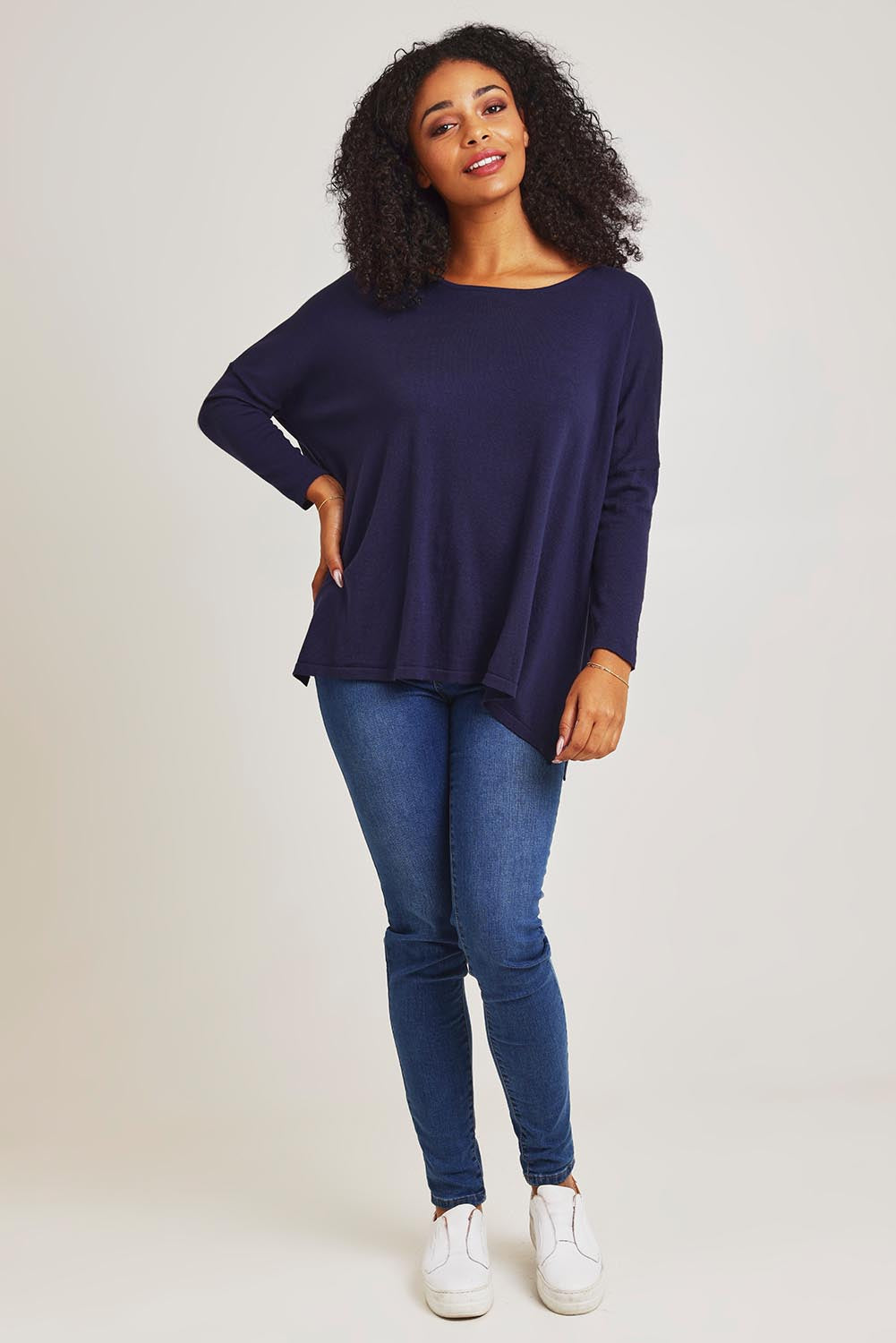 Model Ziara wearing size 10 of the Khaleesi Cotton Knit Top in colour Navy (Blue), from the front, showing the whole outfit