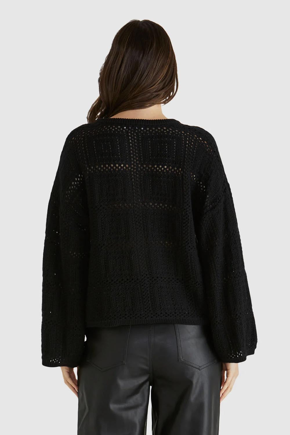 A model wearing the Marcello Cotton Crochet Top in colour Black (Black), from the back
