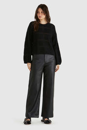 A model wearing the Marcello Cotton Crochet Top in colour Black (Black), from the front, showing the whole outfit