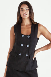 A model wearing the Nico Vest in colour Black (Black), from the front, cropped image