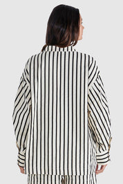 A model wearing the Rohan Cotton Top in colour Stripe, from the back