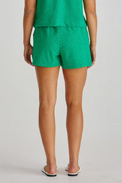 A model wearing the Codi Cotton Blend Short in colour Green (Green), from the back