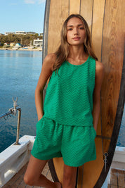 A model wearing the Codi Cotton Blend Short in colour Green (Green), from the front, showing the whole outfit
