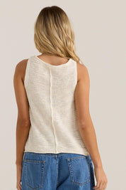 A model wearing the Penn Knit Top in colour Cream, from the back