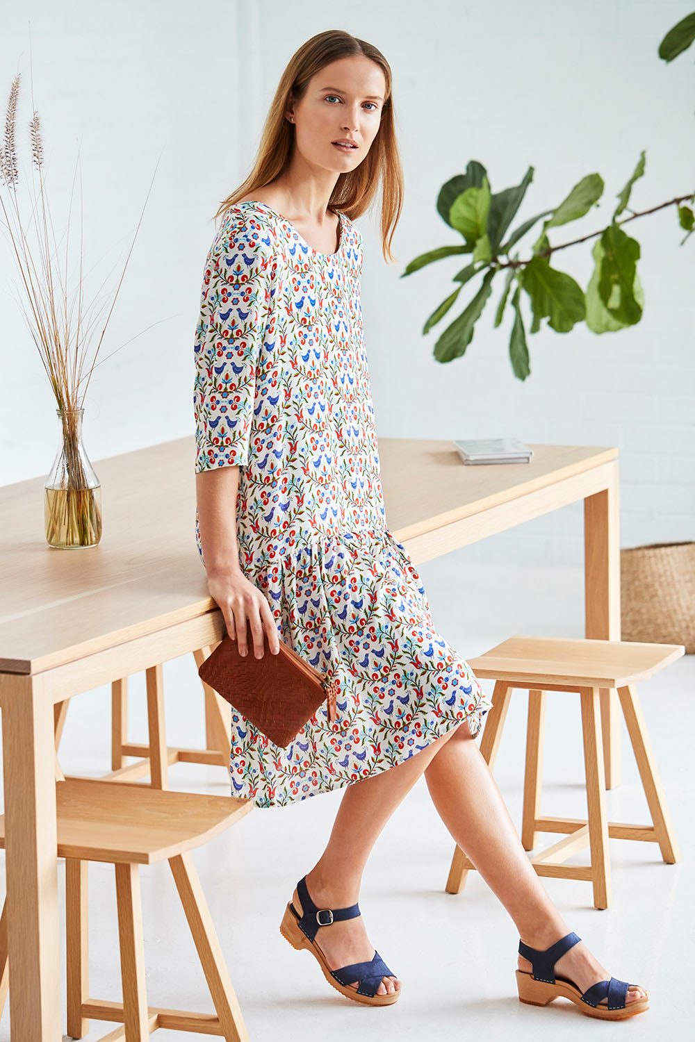 Model Johanna wearing size 10 of the Hygge Drop Waist Dress in colour RedBird (White), from the front, showing the whole outfit
