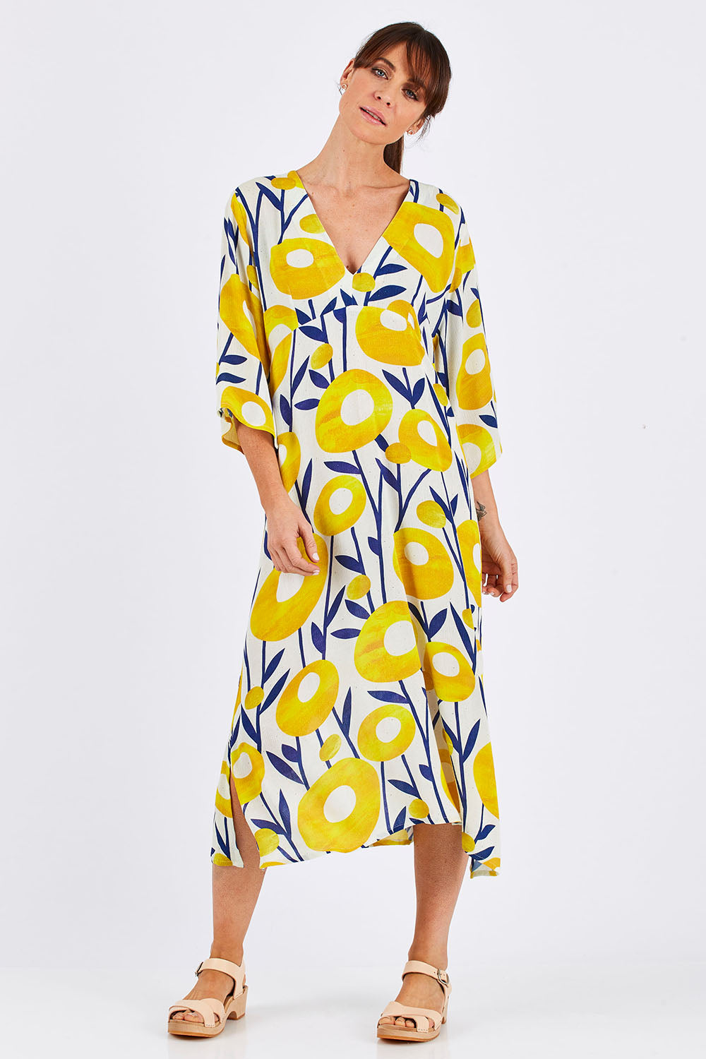 Model Monique wearing size 10 of the Manstrale Midi Dress in colour Poppy, from the front, showing the whole outfit