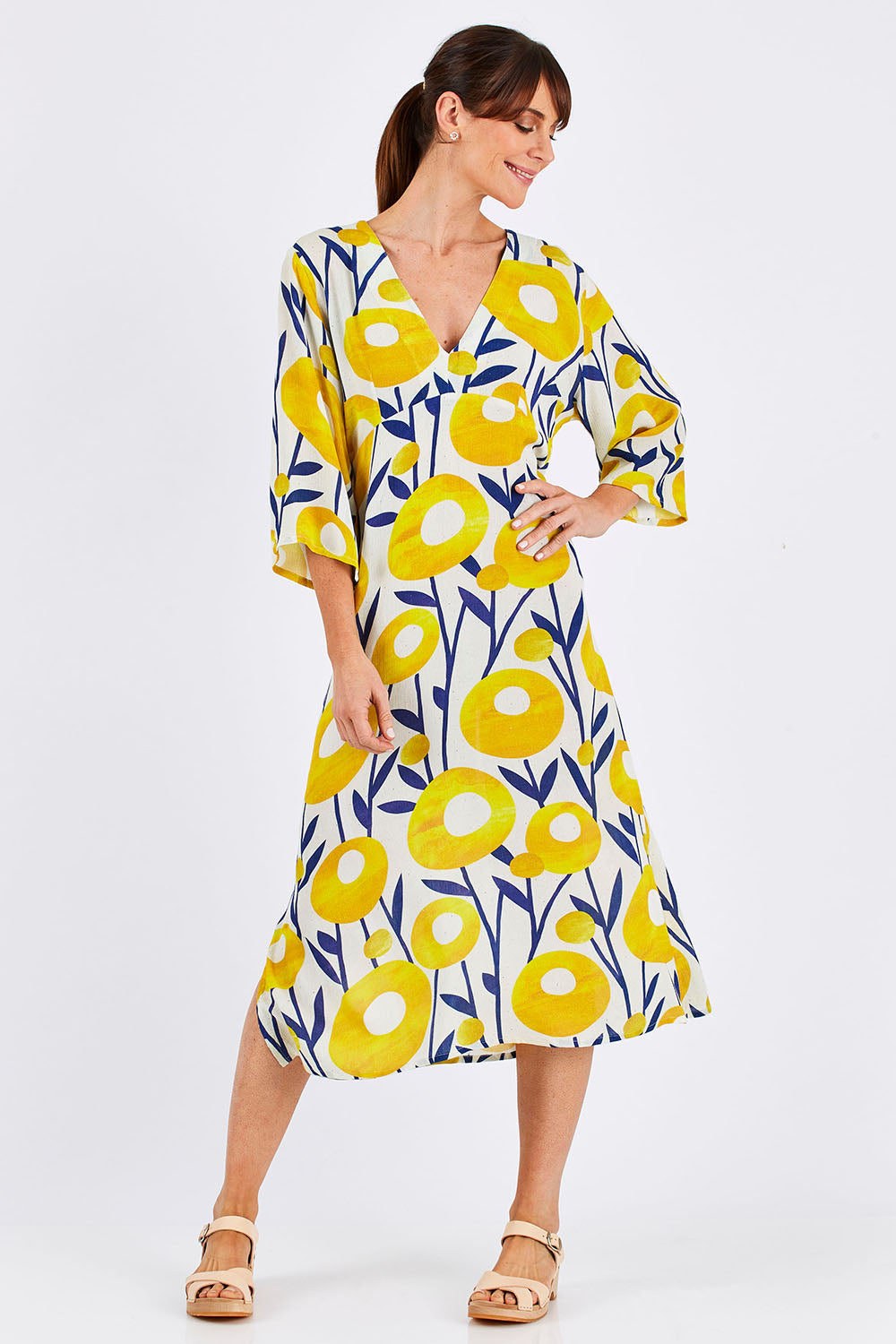 Model Monique wearing size 10 of the Manstrale Midi Dress in colour Poppy, from the front, showing the whole outfit