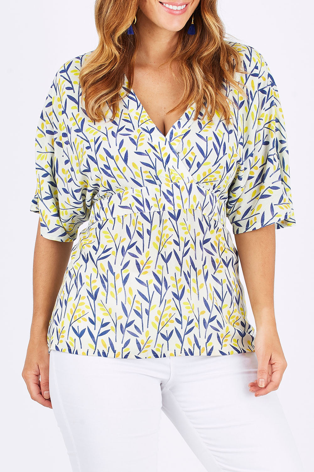 Model Laura wearing size 12 of the Tystnad Blouse in colour YellowPtl, from the front, cropped image