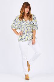 Model Laura wearing size 12 of the Tystnad Blouse in colour YellowPtl, from the front, showing the whole outfit